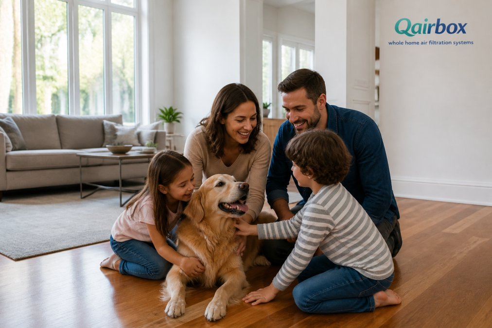 Family with young children and a golden retriever playing together in a bright, spacious living room with clean hardwood flooring and large windows, showing a well-maintained home environment