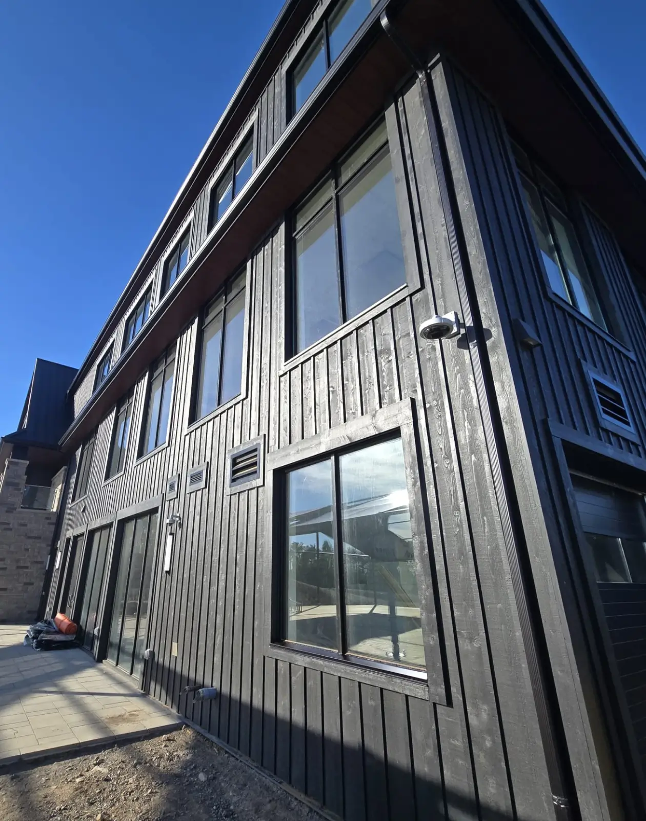 Architectural wood siding system providing natural aesthetics, texture, and long-lasting exterior building protection.