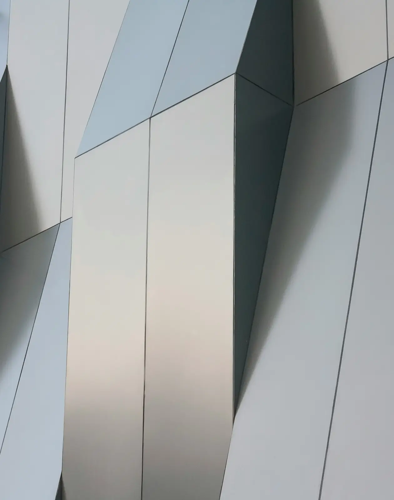 Aluminum composite material (ACM) panel cladding with clean lines and modern detailing on a contemporary building facade.