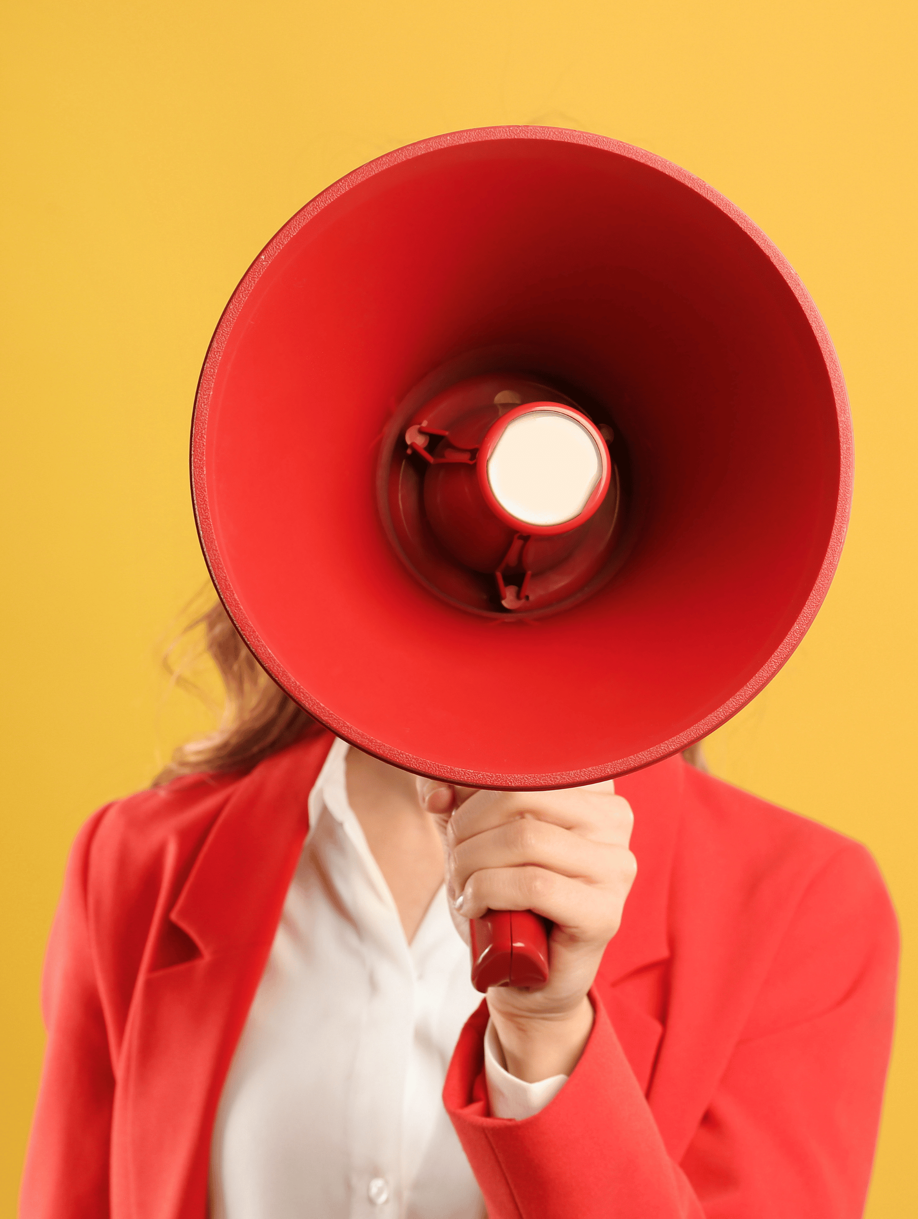 Woman holding a megaphone, face not visible