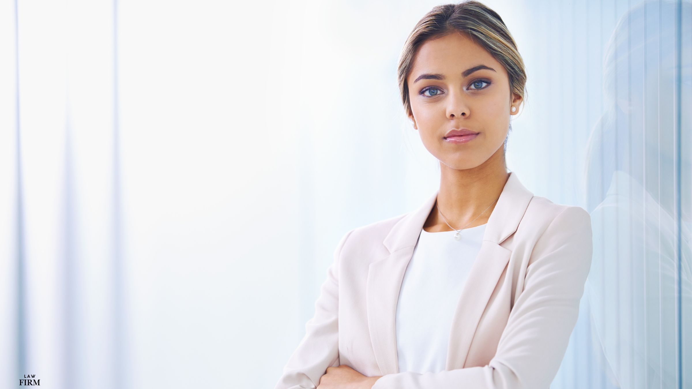 Professional woman with a confident expression looking directly at the camera