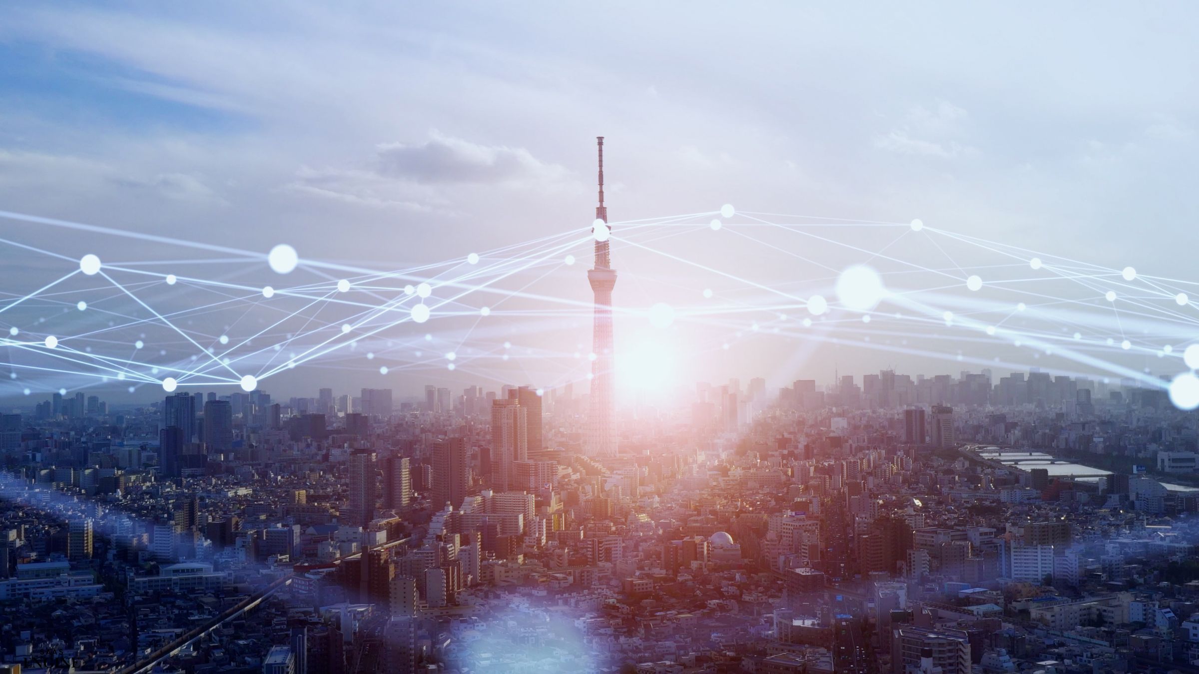 Wide city view with one tall building highlighted by a connectivity-style overlay