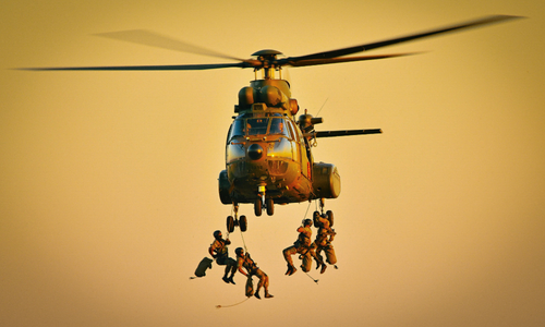 Helicopter dropping several people