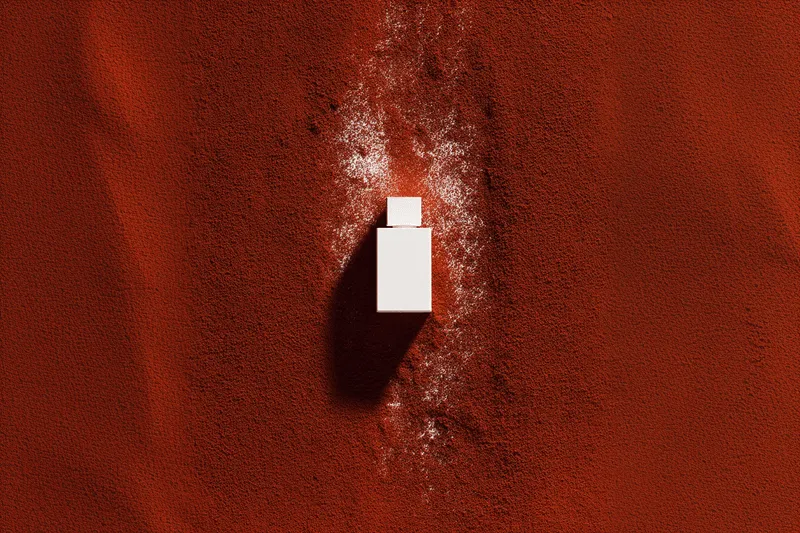 A USB drive resting on orange clay or dust