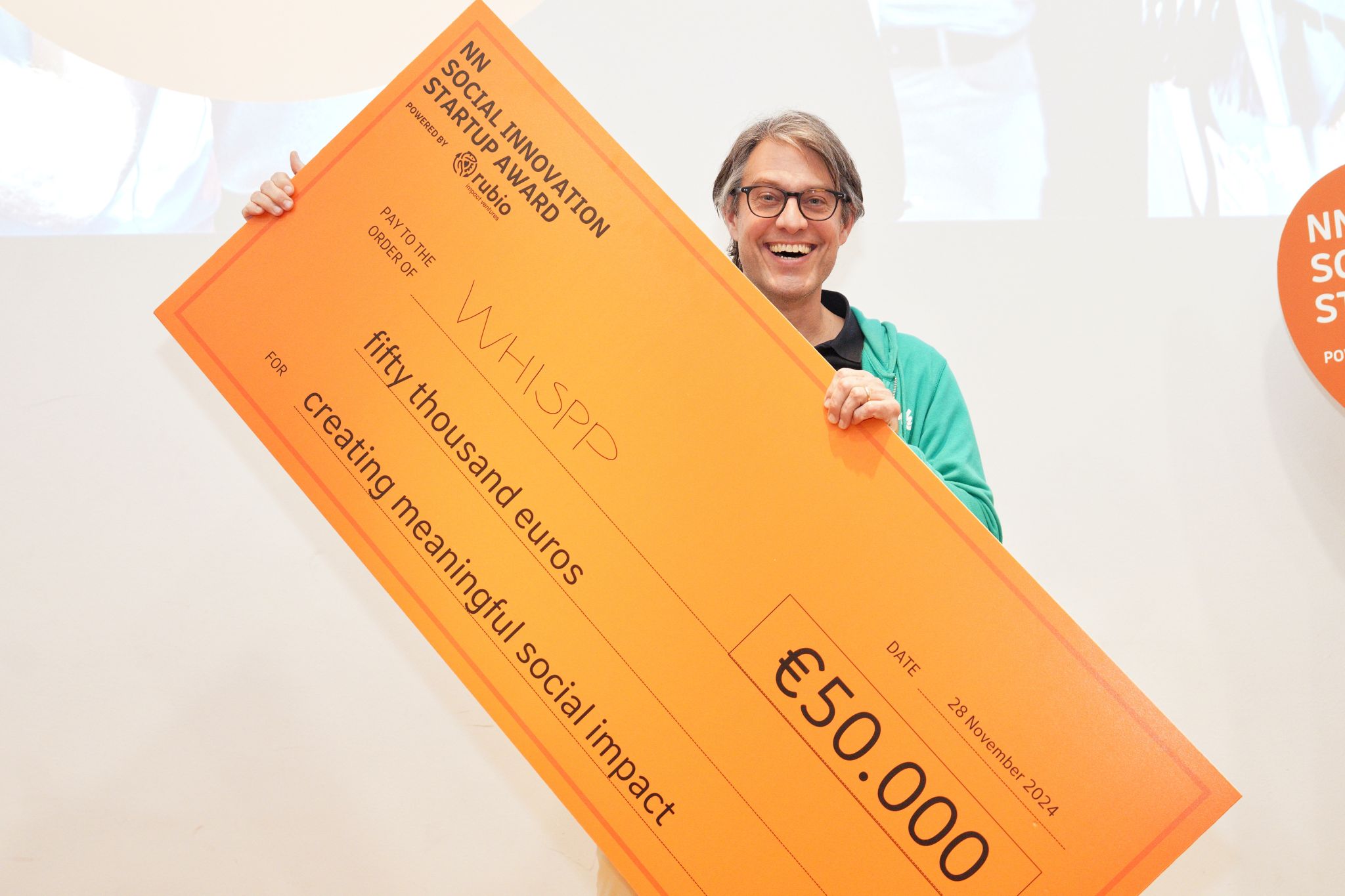 CEO Joris Castermans holding NN Social Innovation Startup Award prize