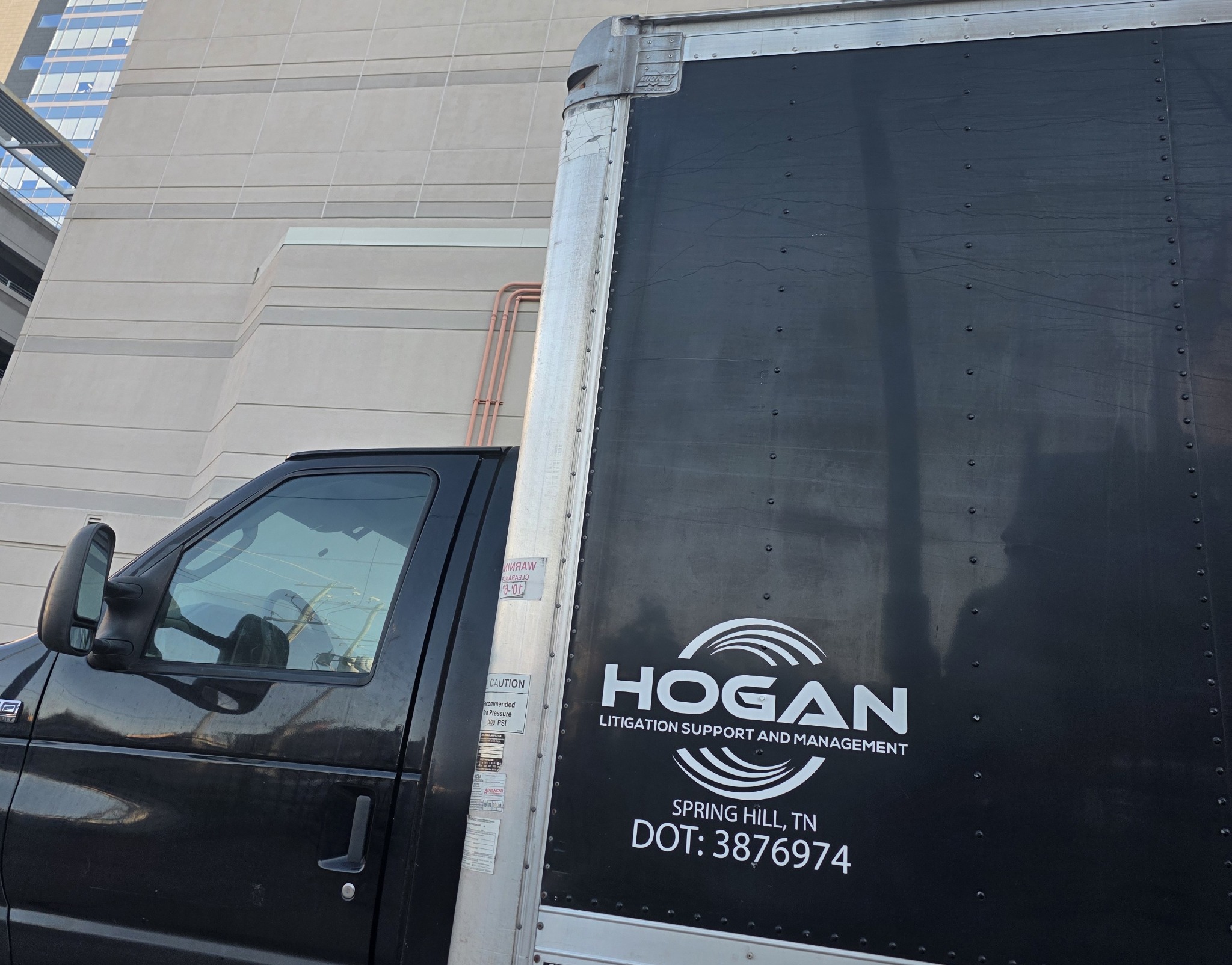 Hogan company-operated vehicle transporting trial materials and equipment