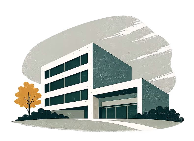Modern commercial building with three floors, large windows, and surrounding greenery and a tree.
