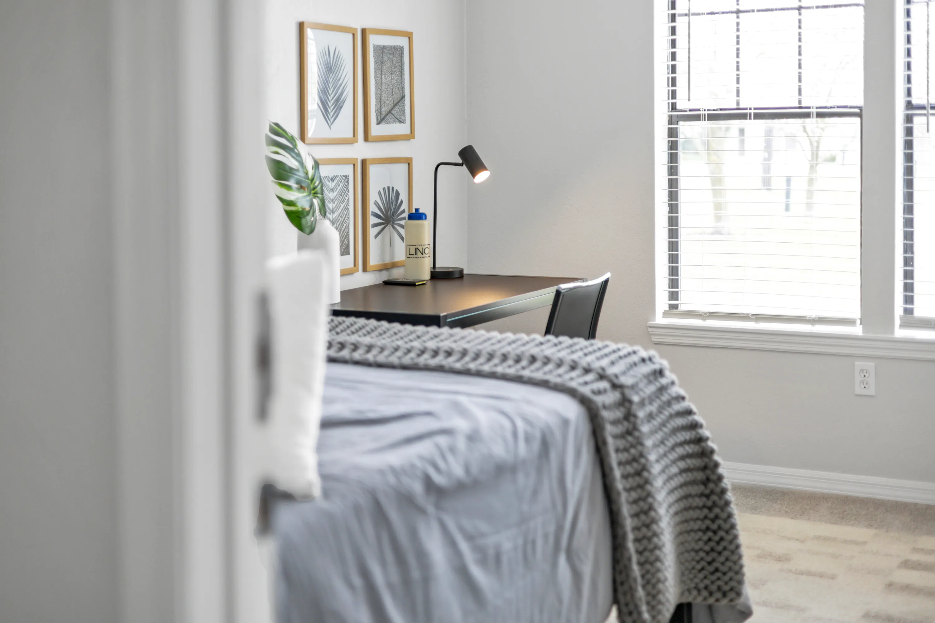 Furnished bedroom in the D1 apartment at The Foundry
