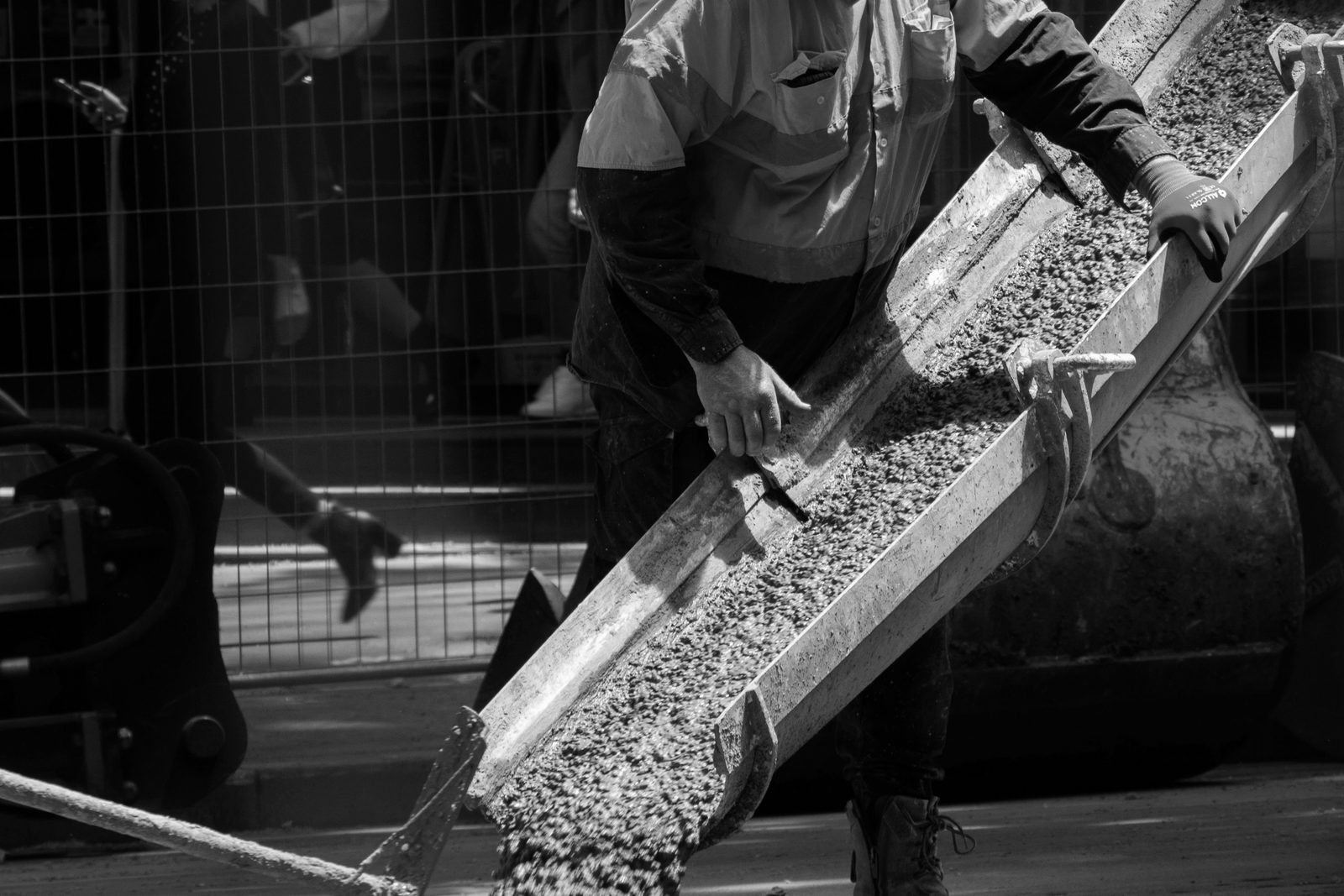 Wet concrete running down a chute on a job