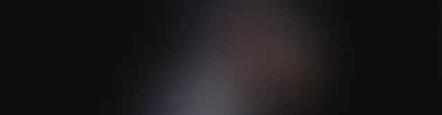 Black gradient background fading from dark to lighter shades in the center.