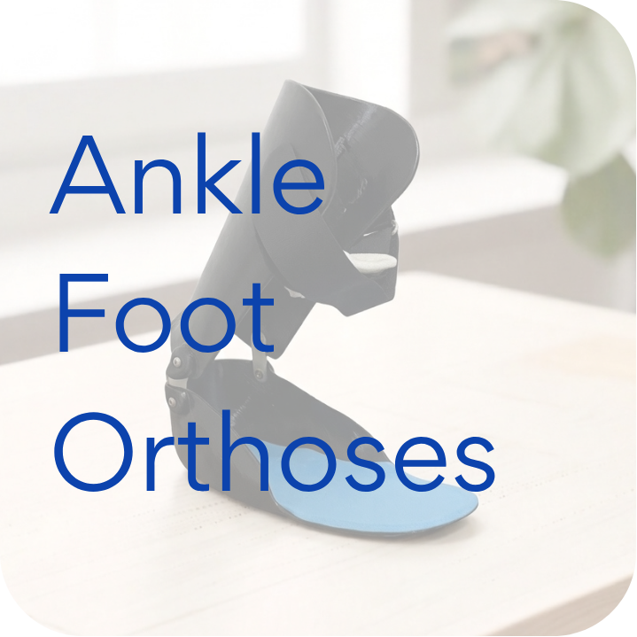 Black ankle foot orthosis with blue footplate on a light wood surface.