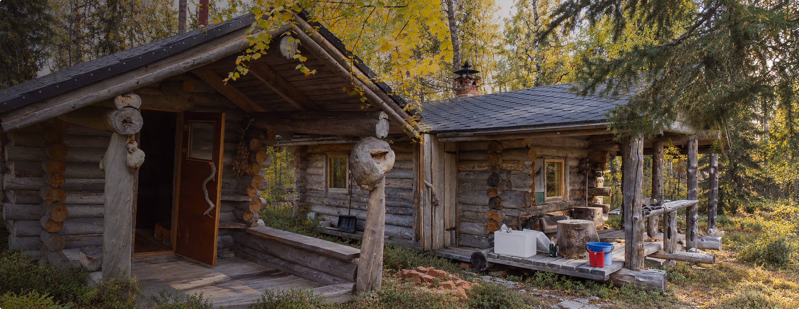 Traditional log sauna cabins in a Finnish forest