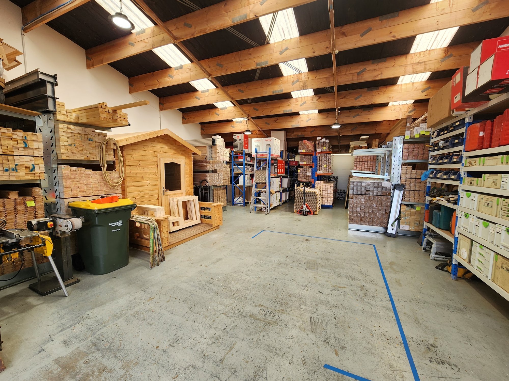 Inside the Auckland workshop with racks of Finnish timber
