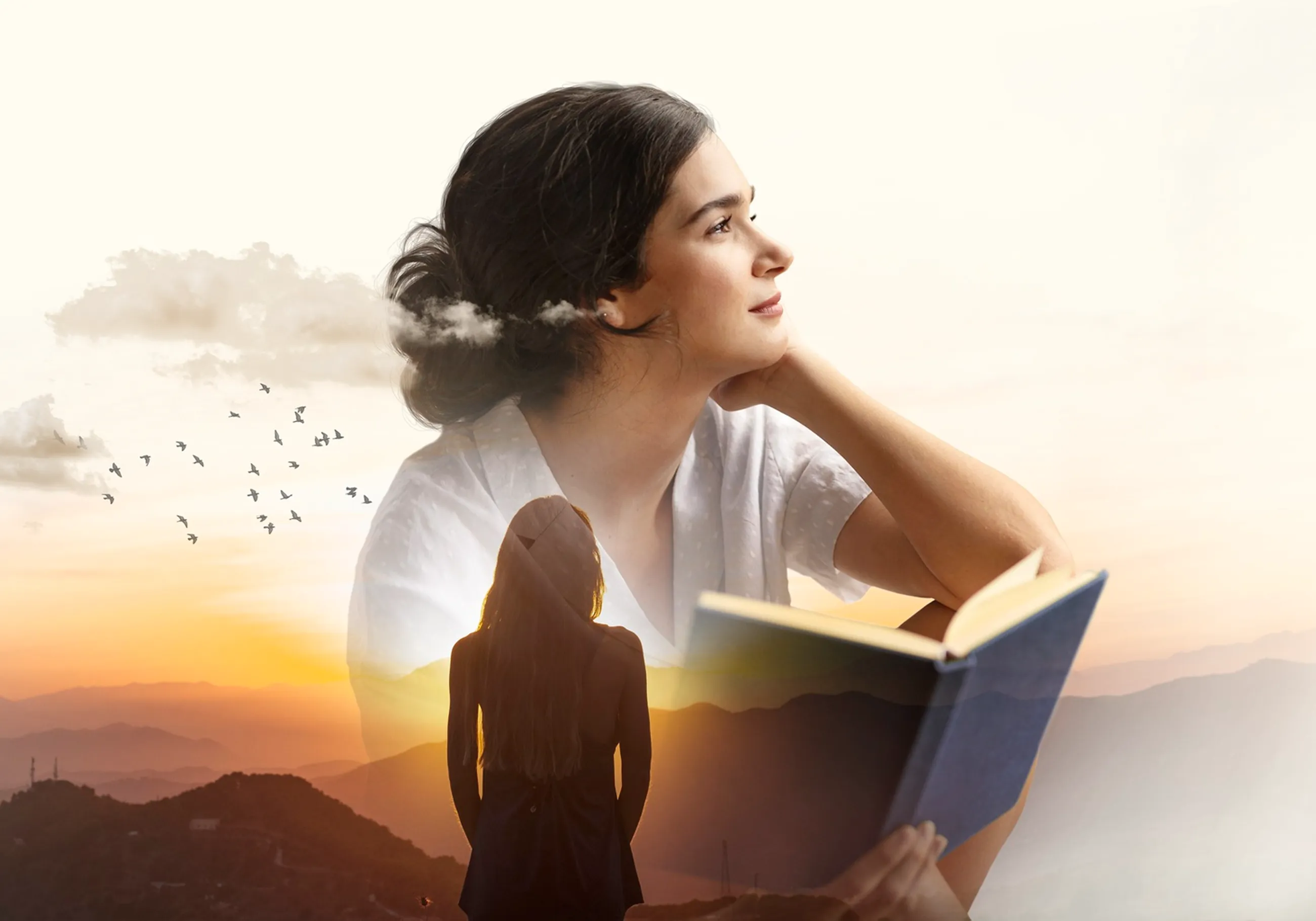 Double exposure of a woman reading and a woman looking at a sunset over mountains with flying birds.