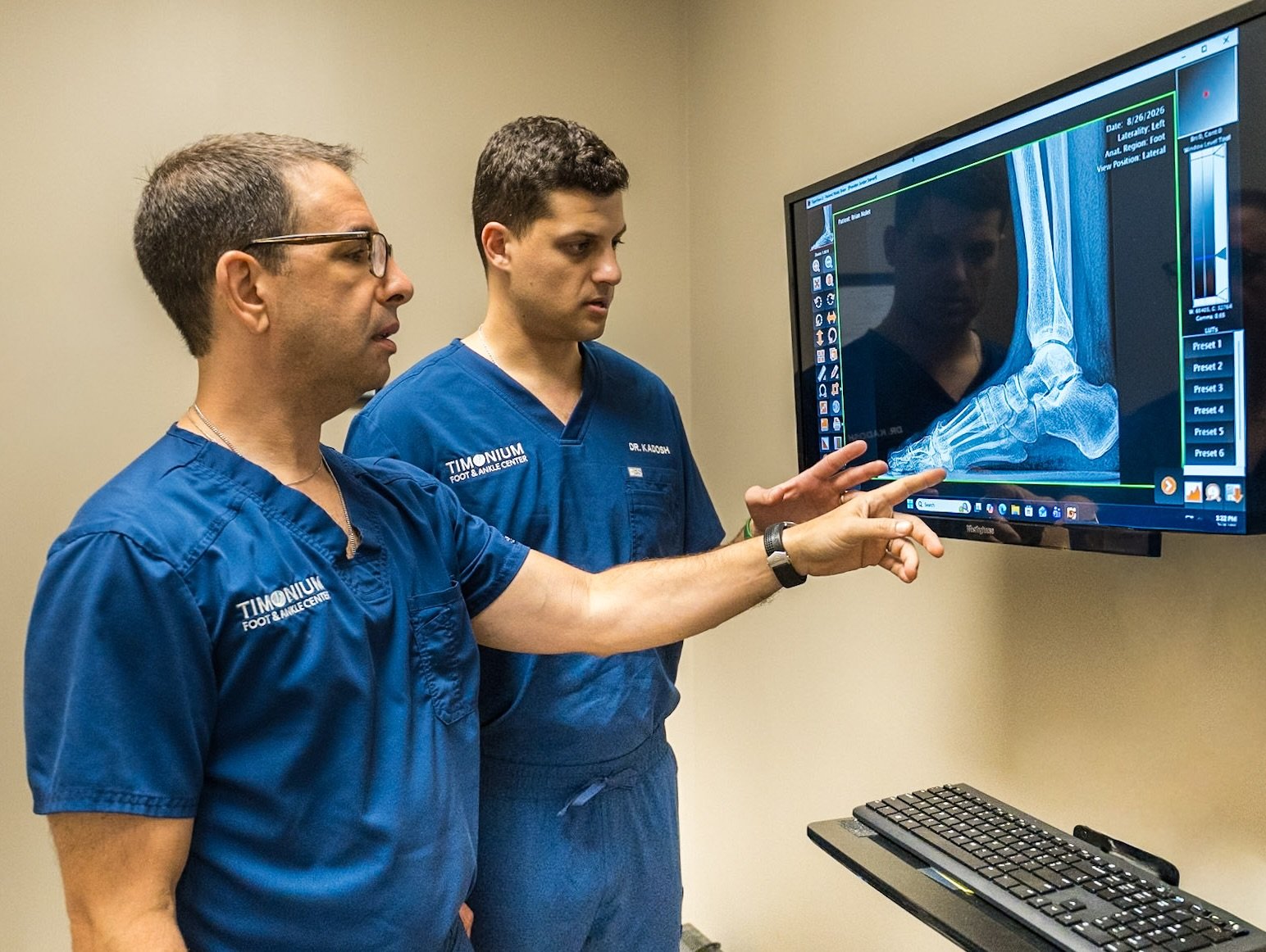 Dr. Jordan Stewart examining a patient's foot at Timonium Foot and Ankle Center
