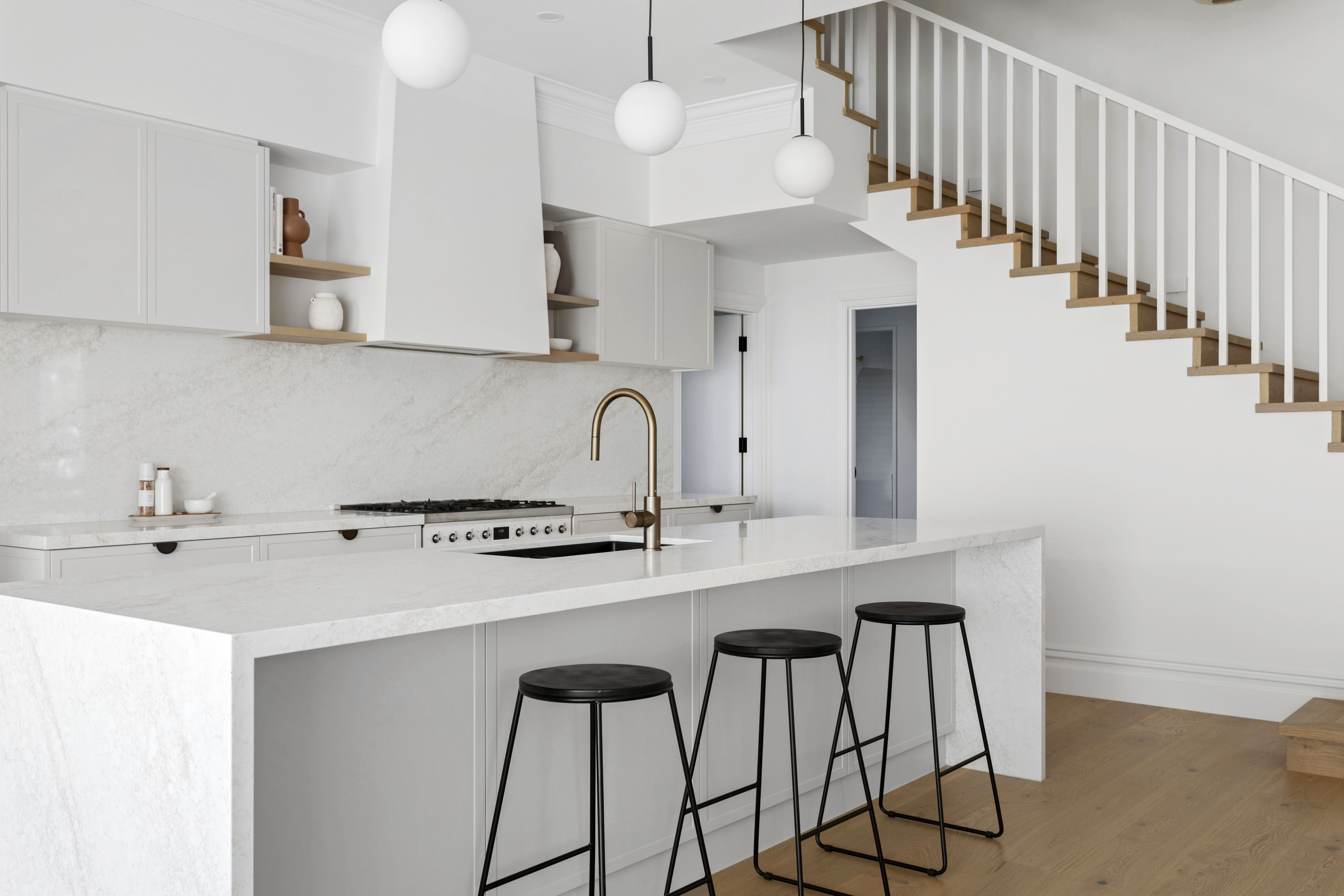 Styled kitchen with marble island and pendant lighting