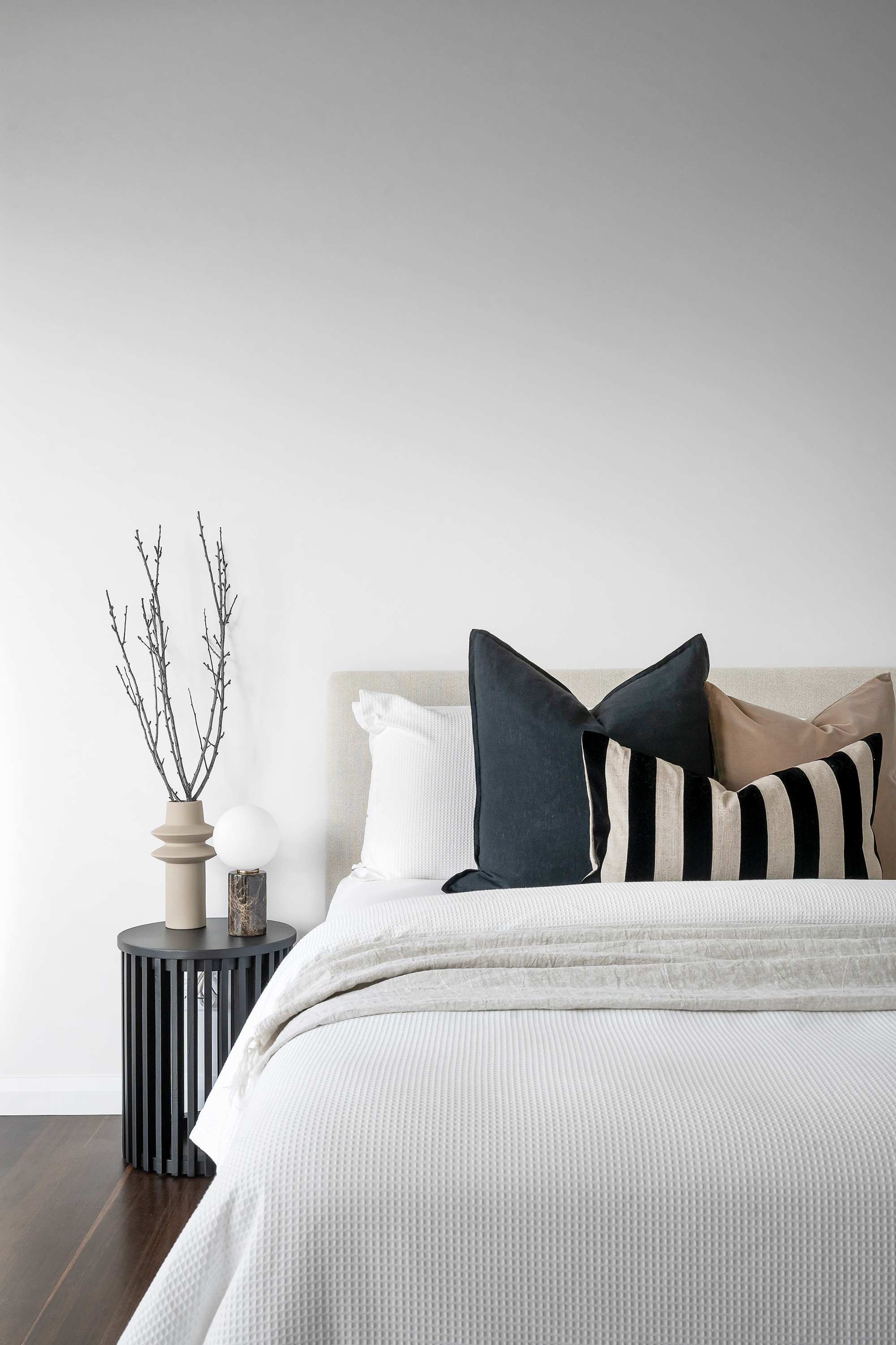 Styled bedroom bedding and cushion detail