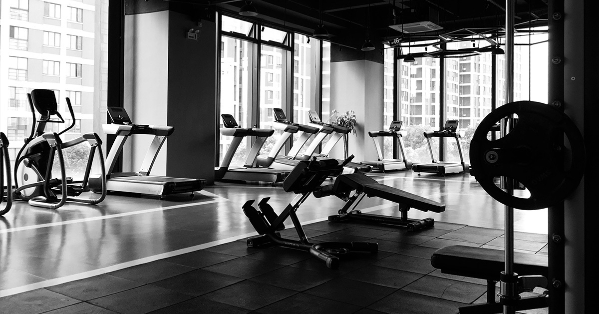 a gym with treadmills and exercise machines
