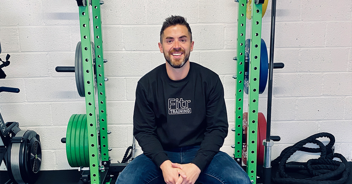 a man sitting in a gym