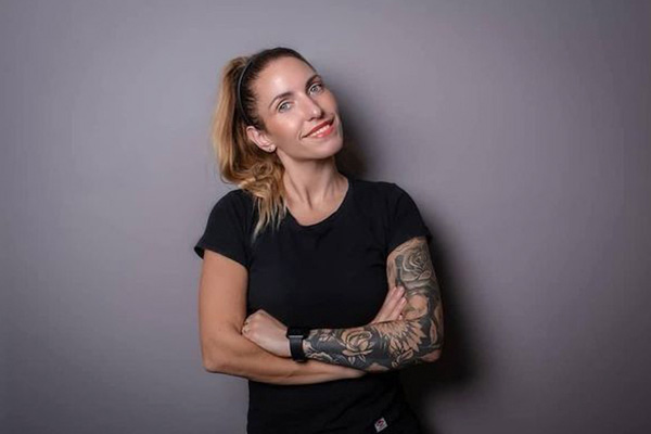 a woman with tattoos on her arm