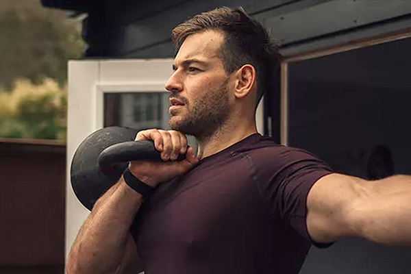 a man lifting a weight