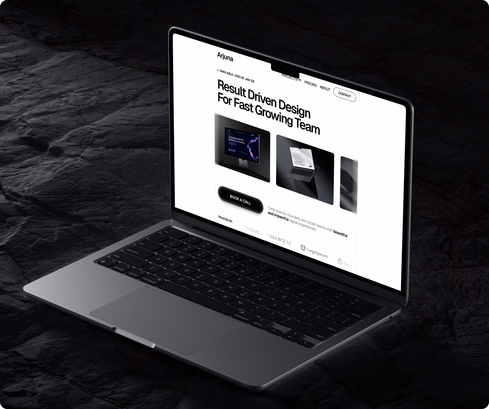 Open laptop displaying a website homepage with the headline 'Result Driven Design For Fast Growing Team' and a 'Book a Call' button.
