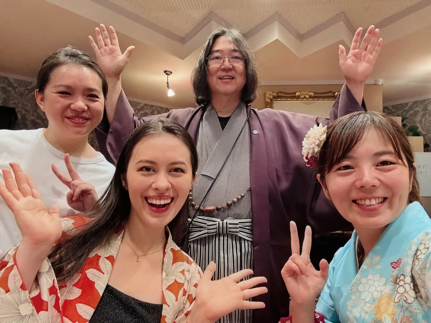 Ken Honda in kimono celebrating with guests on the final day