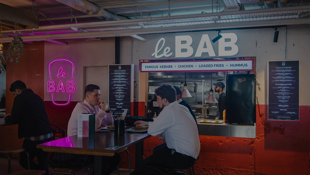 The Le Bab counter at Market Halls Oxford Street, with diners at the bar