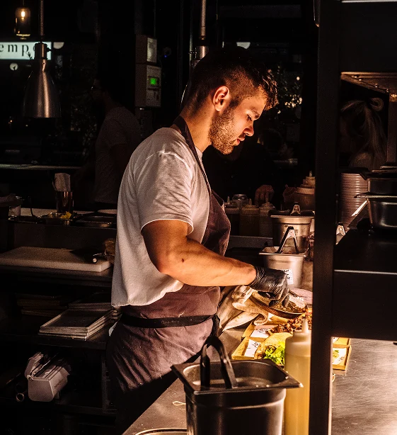 Chef assembling kebabs at the counter, Le Bab Soho