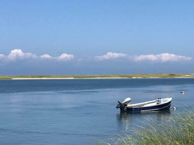 Cottages and boats along Napeague Harbor at Lazy Point in Amagansett.