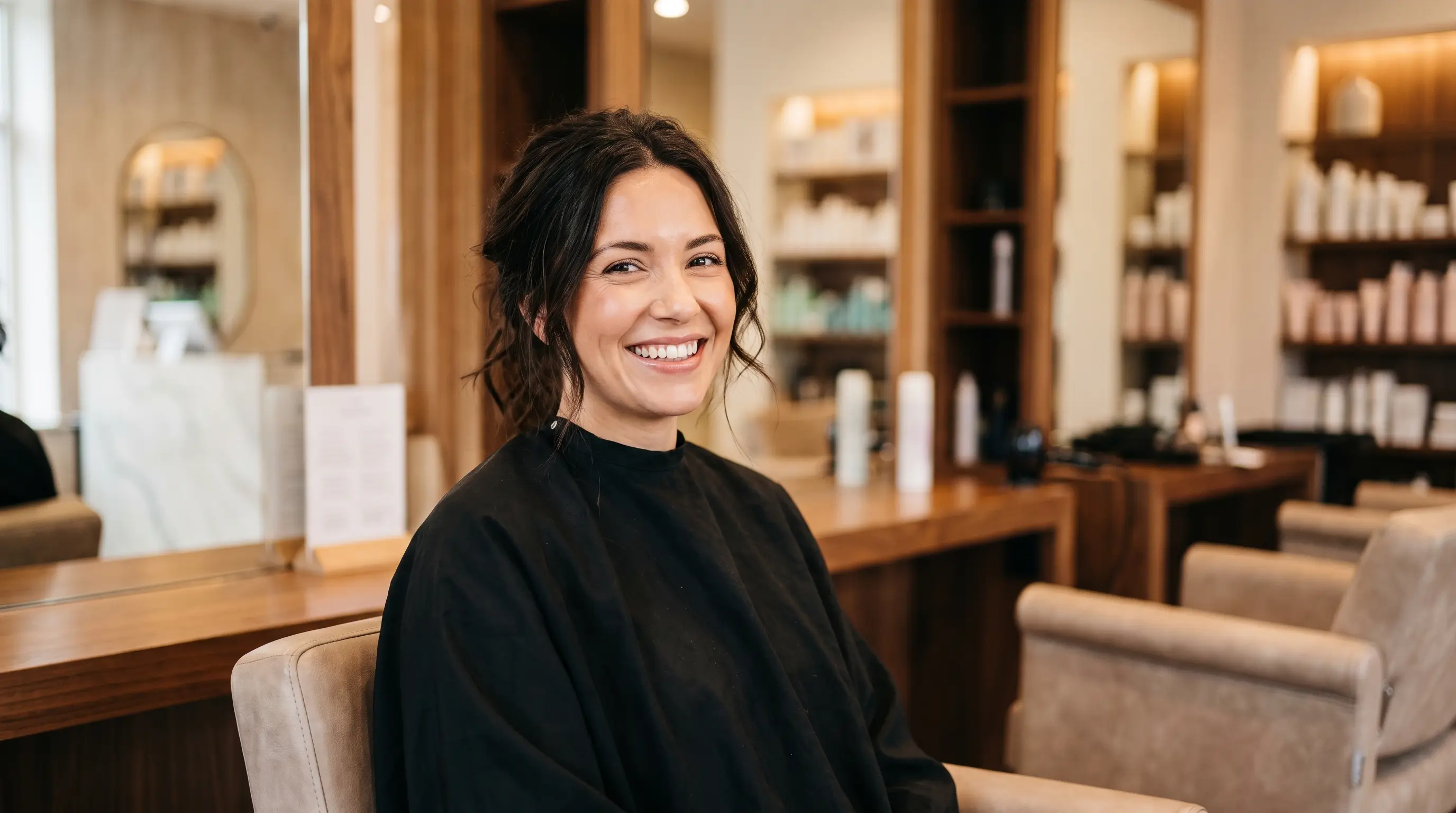 A certified Glowence graduate in the salon