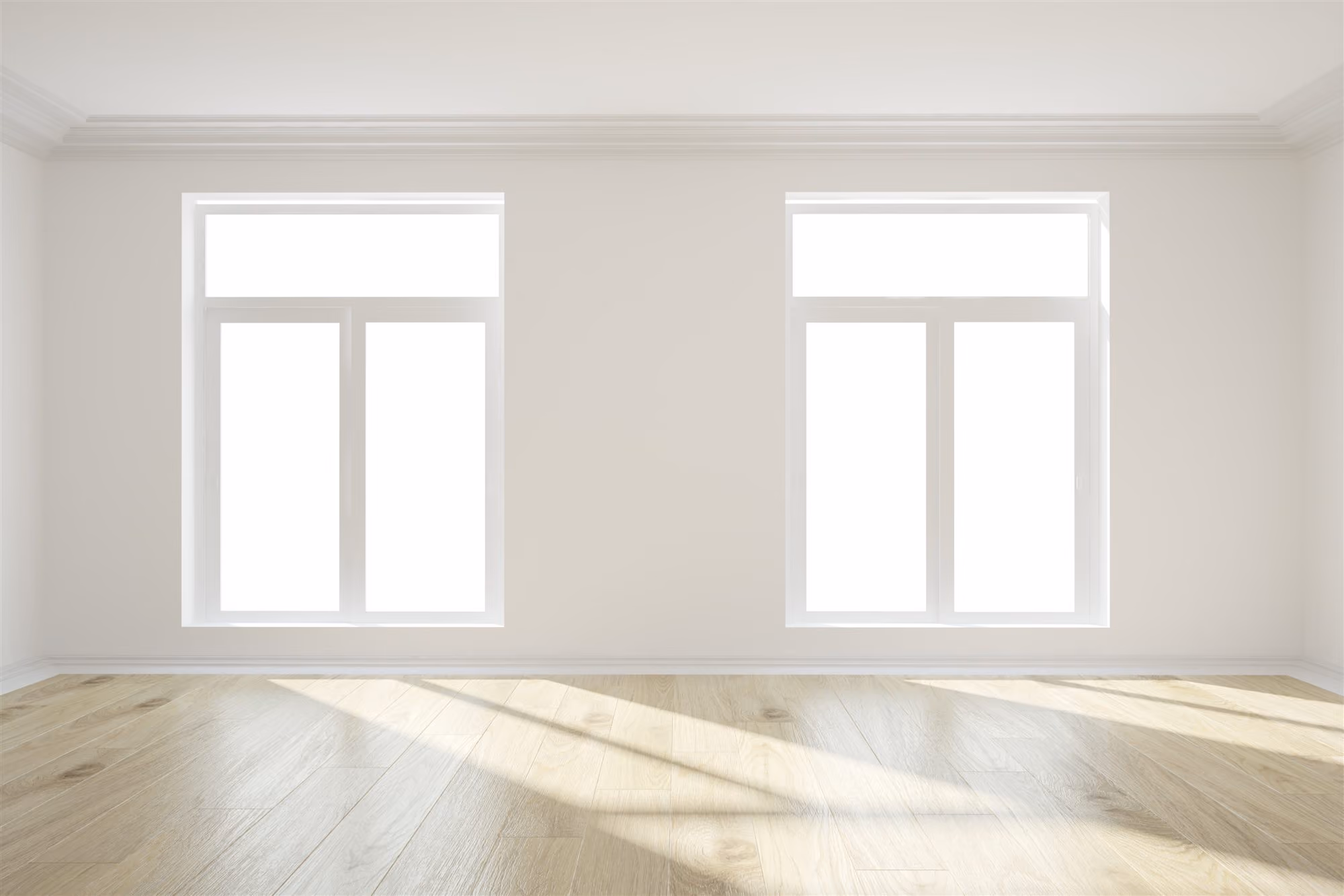 Bright empty room with light wooden flooring and two large rectangular windows letting in natural sunlight.