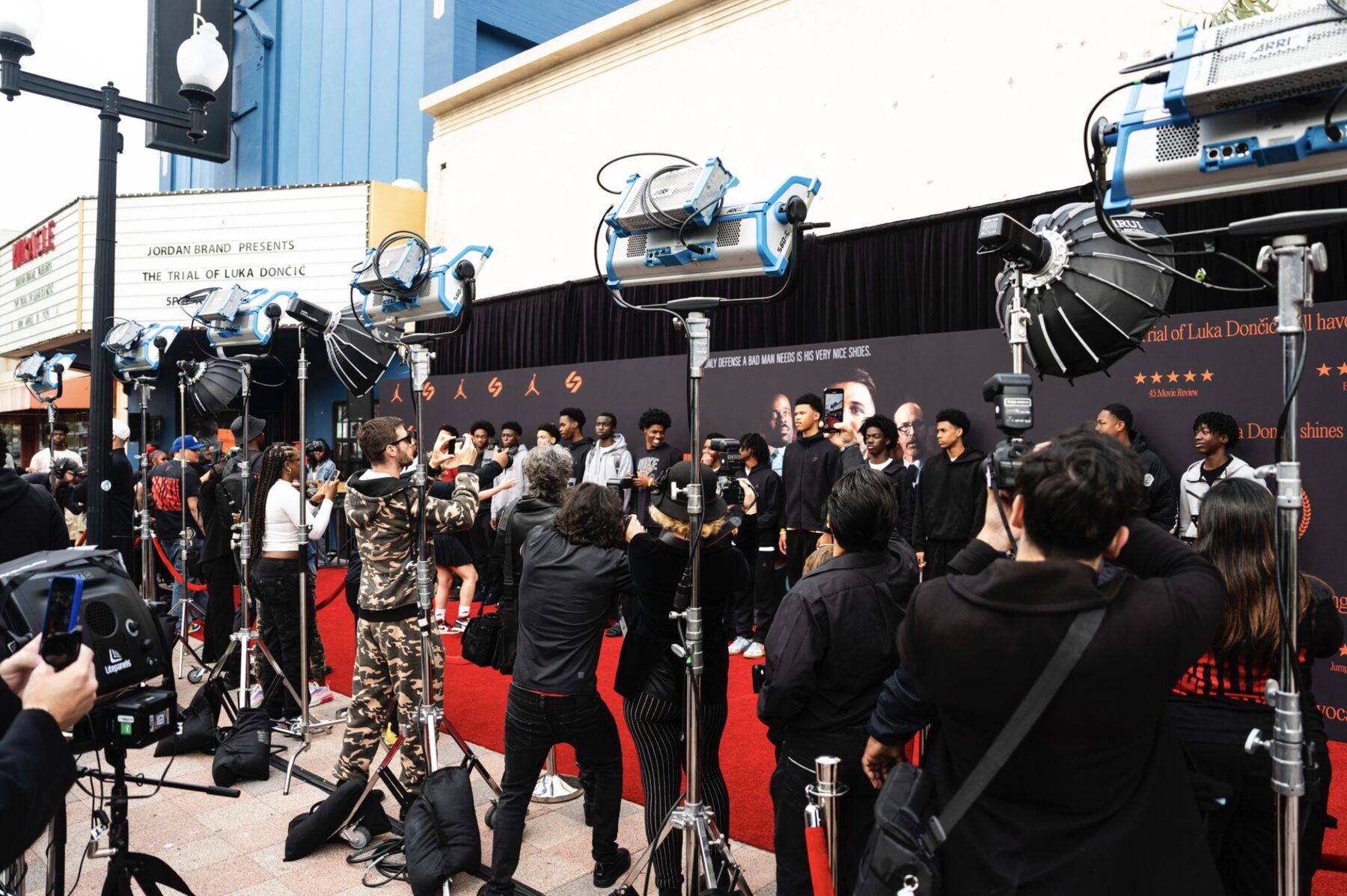 Red carpet running along the front of the theater