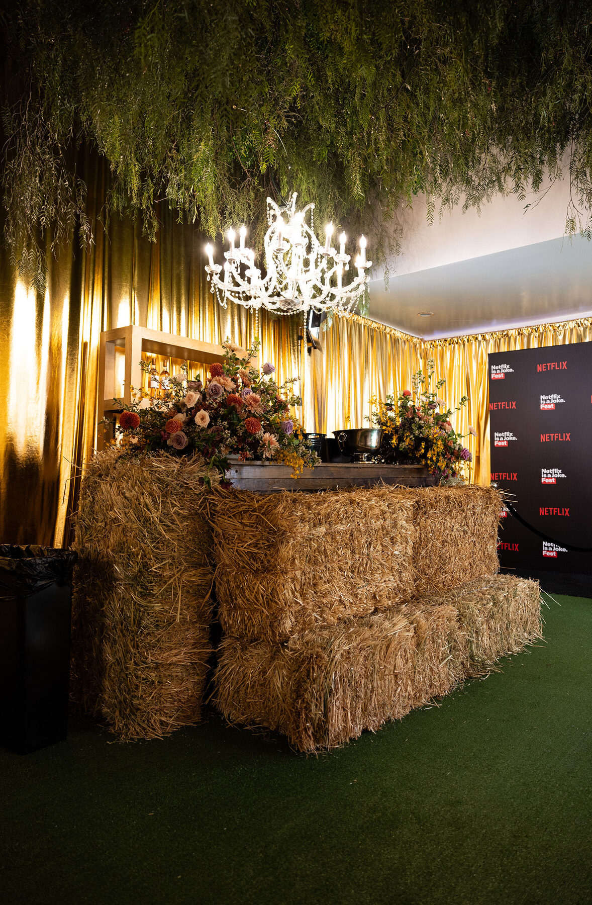 Hay bales and gold fringe framing the entrance