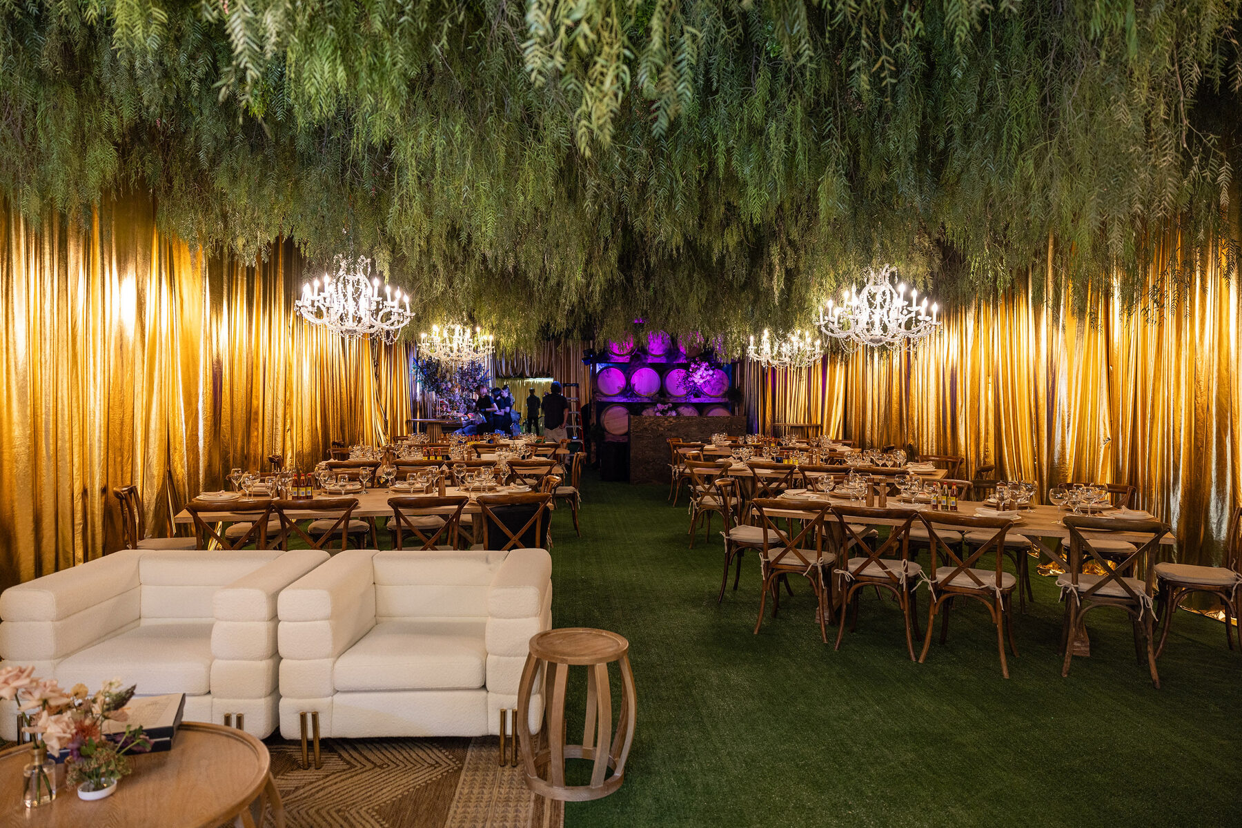 The Wing dressed with gold fringe and chandeliers