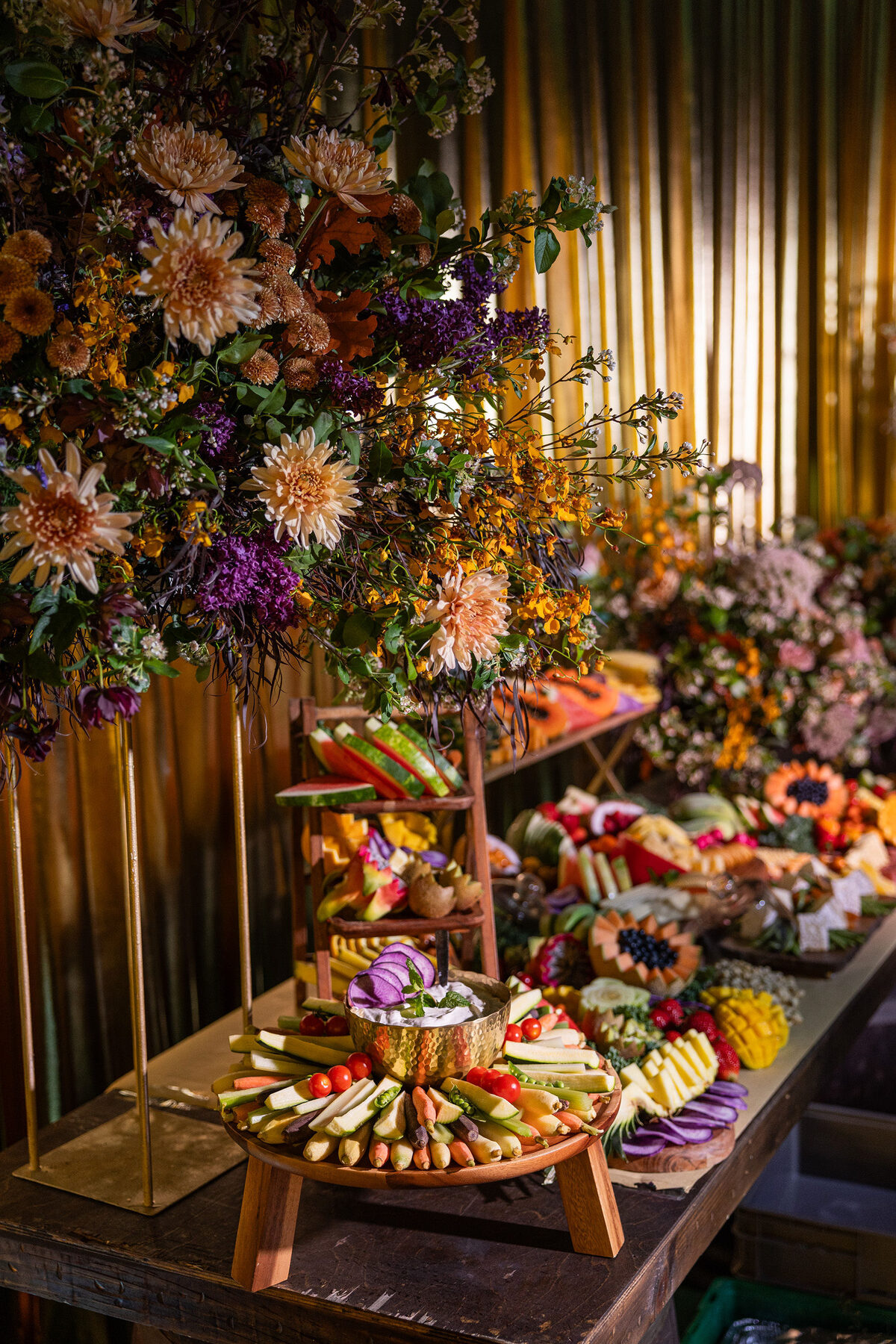 Grazing table dressed with flowers and food