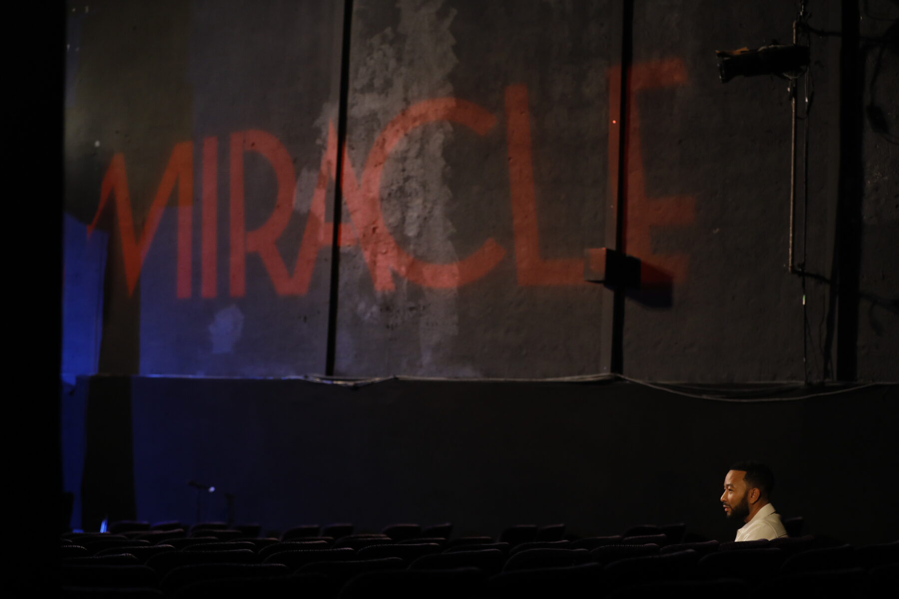 The Miracle name painted on the back wall of the house