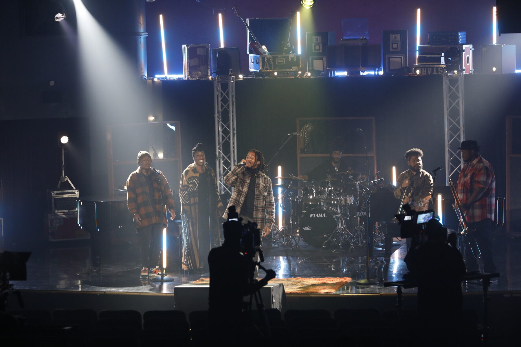 Wide view of the set with the crew working the floor