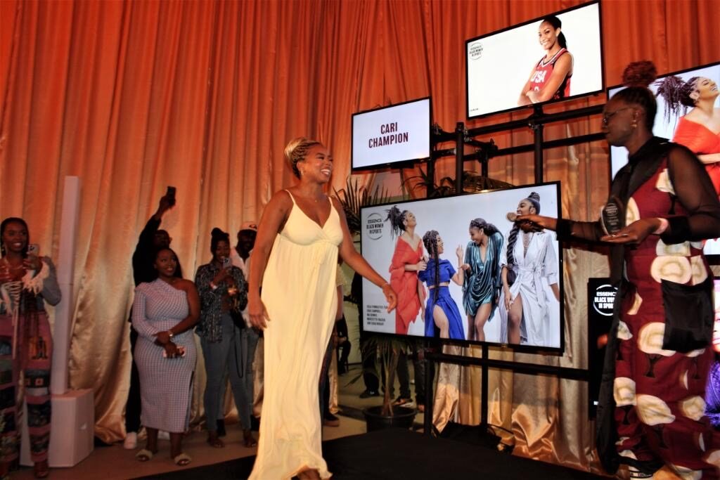 The draped room with screens running the honorees' stories