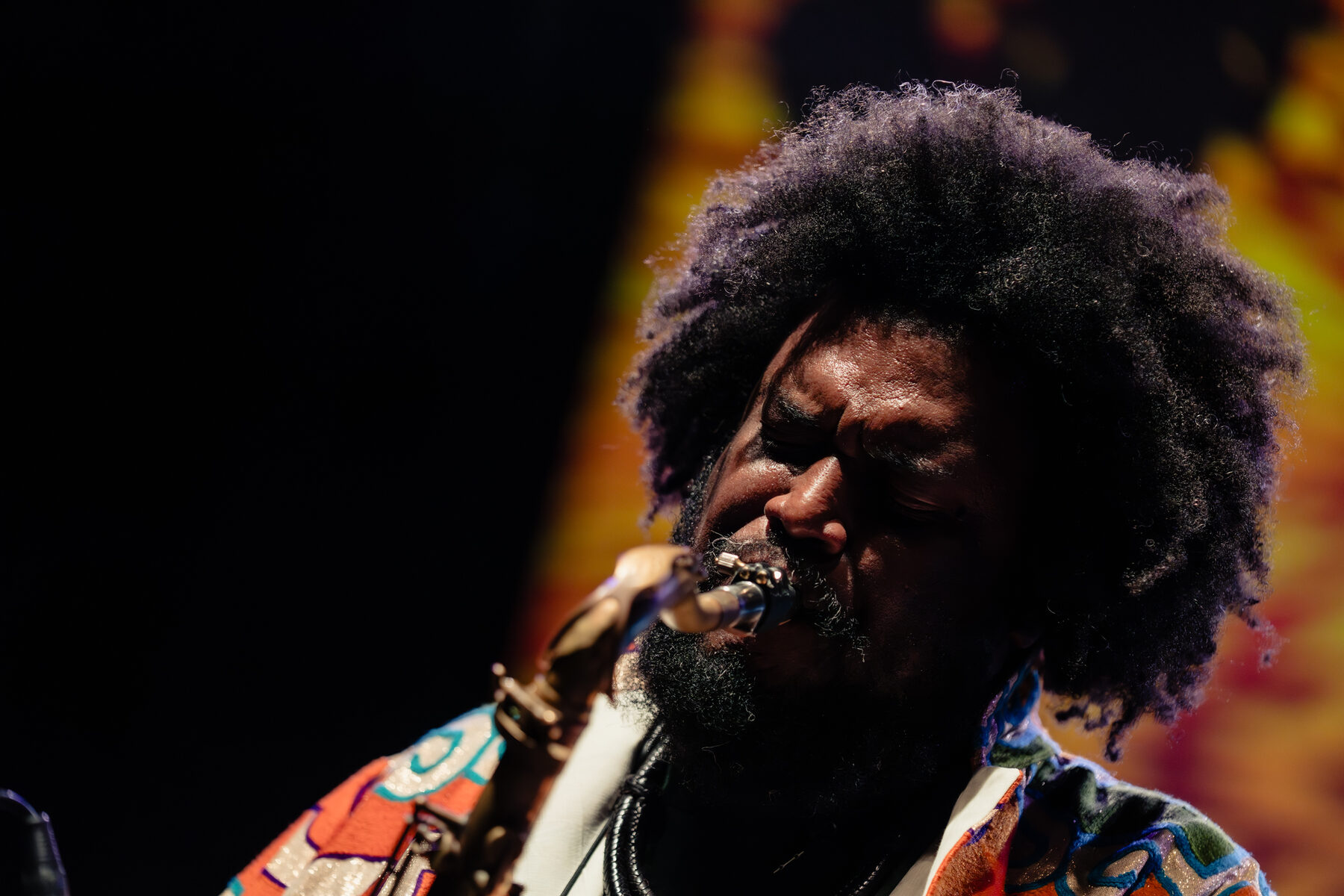 Close-up of Kamasi Washington on saxophone