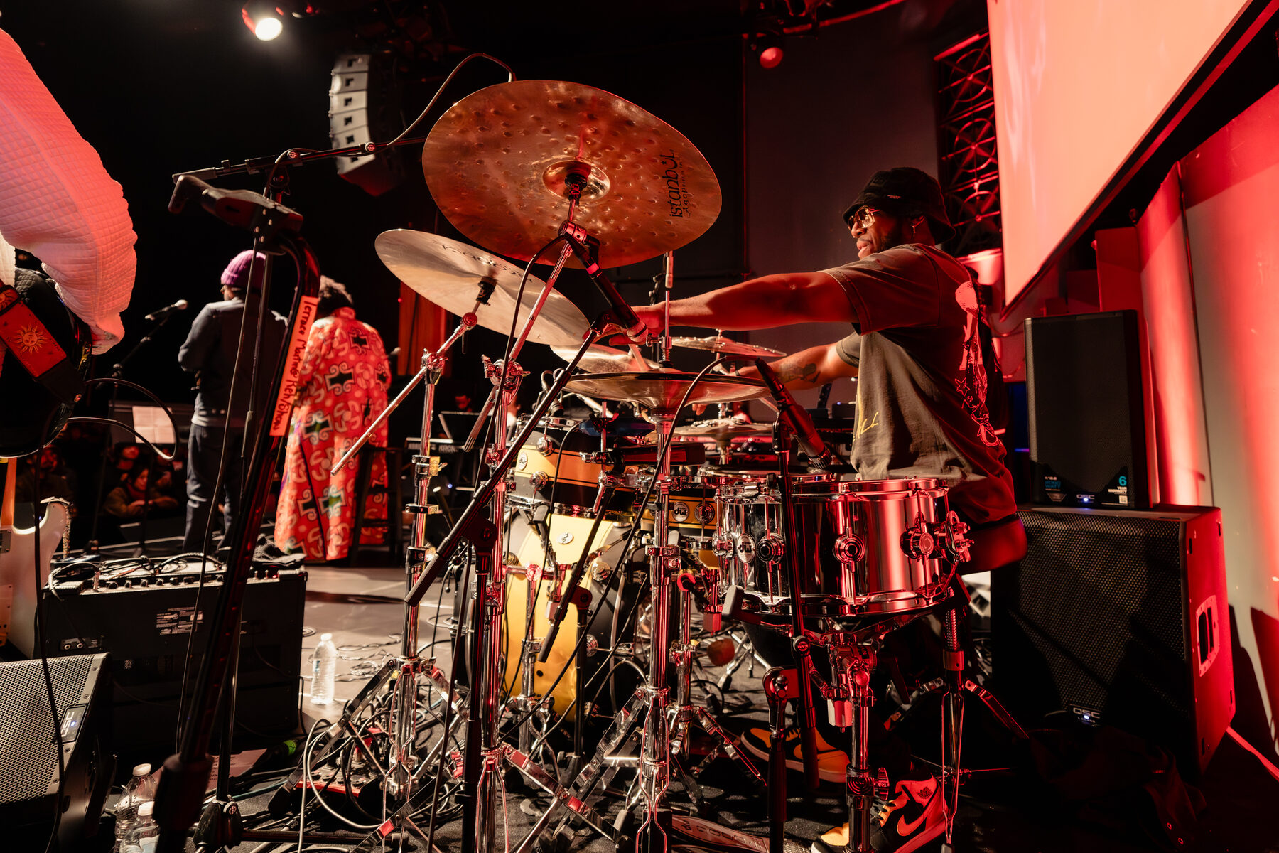 Drummer behind the kit under the truss