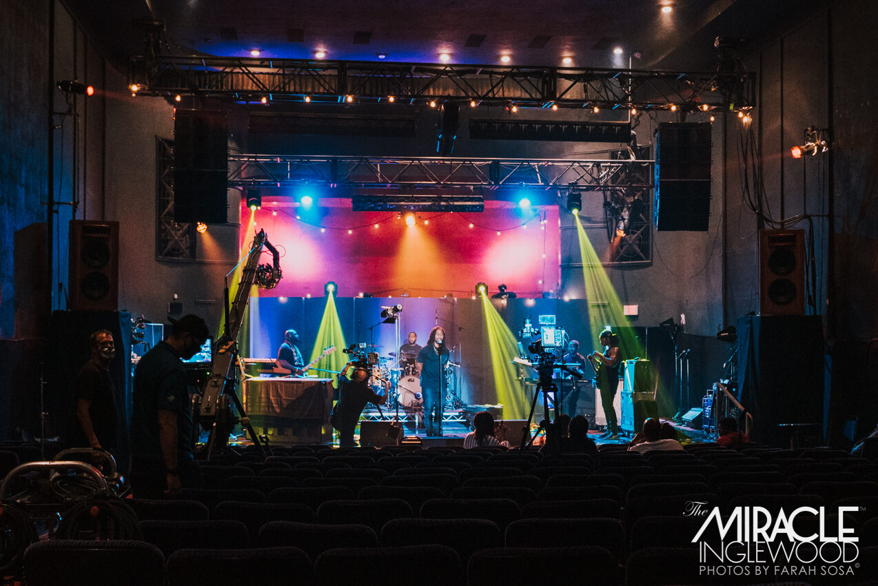 Band performing on the lit main stage during a live event