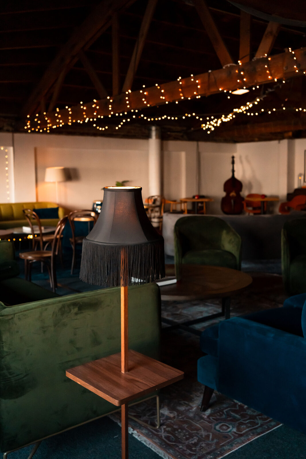 Velvet sofas and warm lamps in the mezzanine lounge