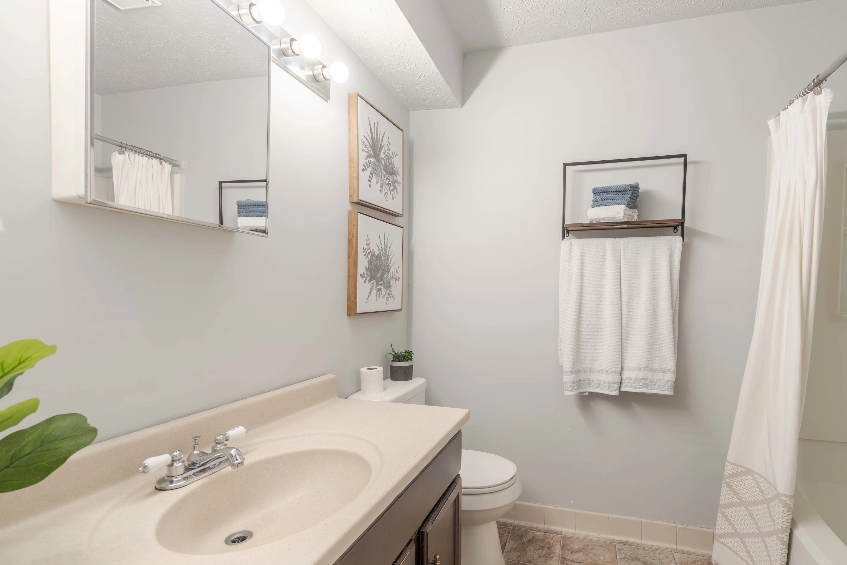 Bathroom with single sink and shower tub