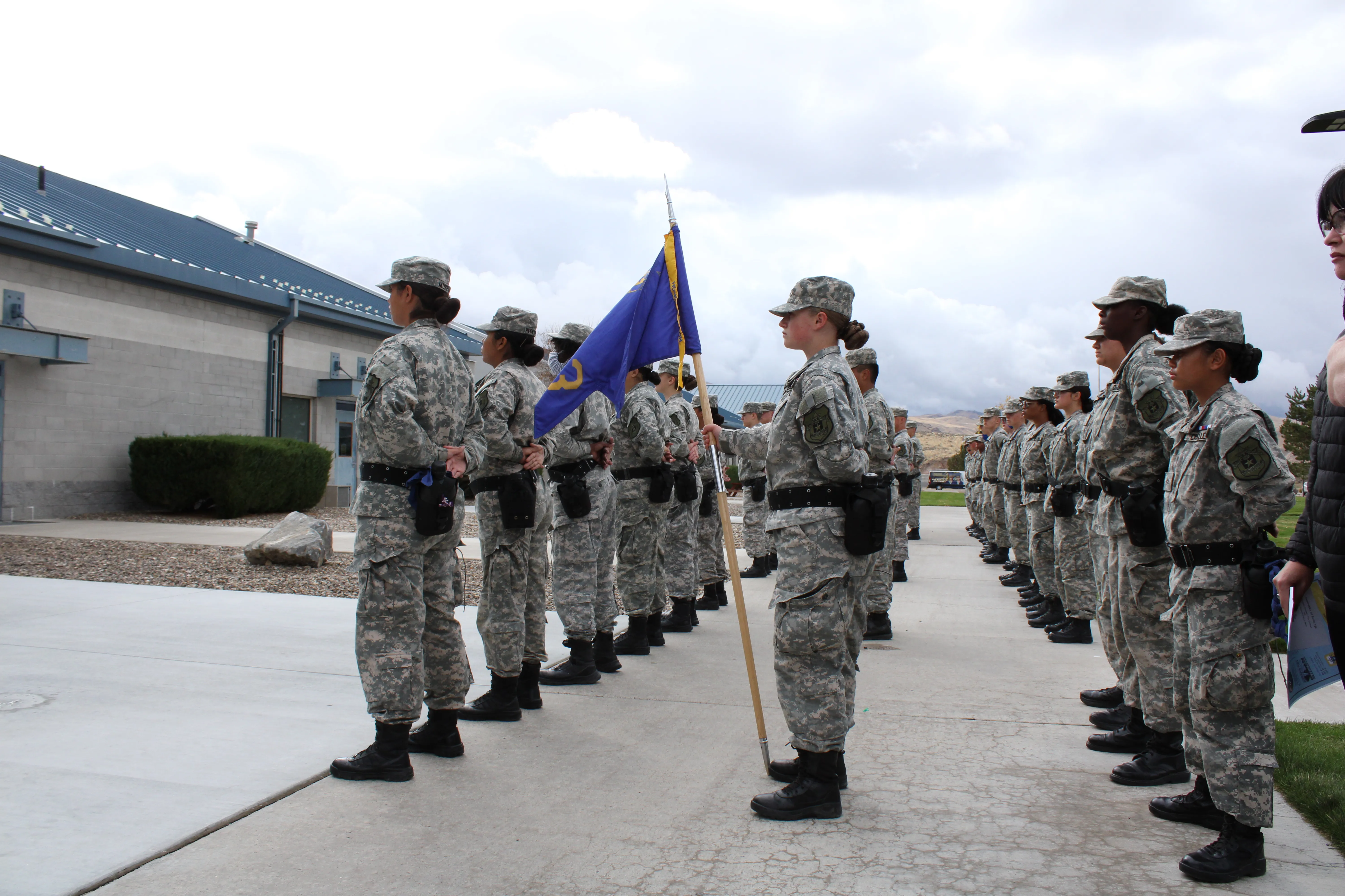 BBYCA cadets in formation holding the platoon flag