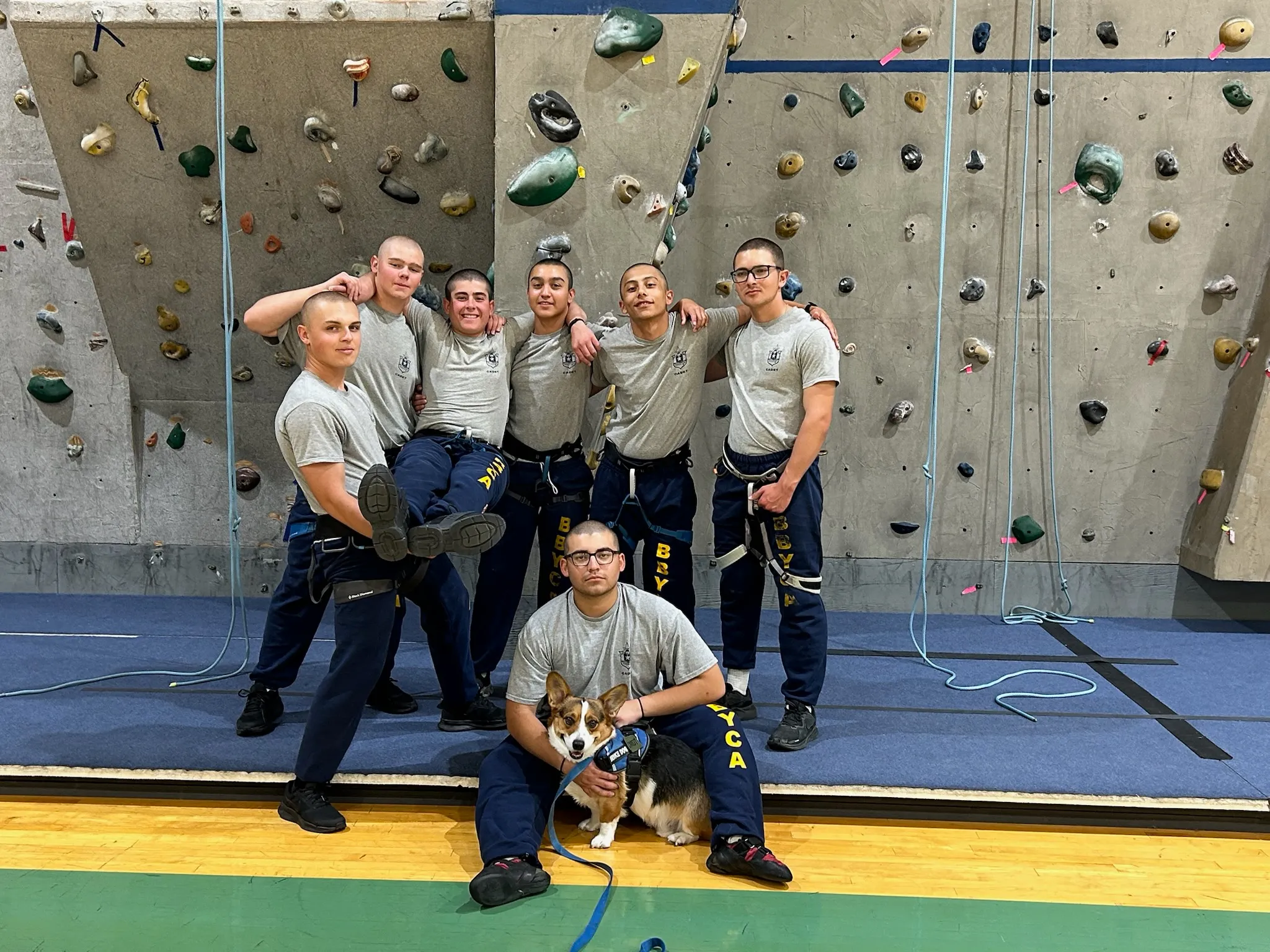 BBYCA cadets at the climbing wall with a corgi