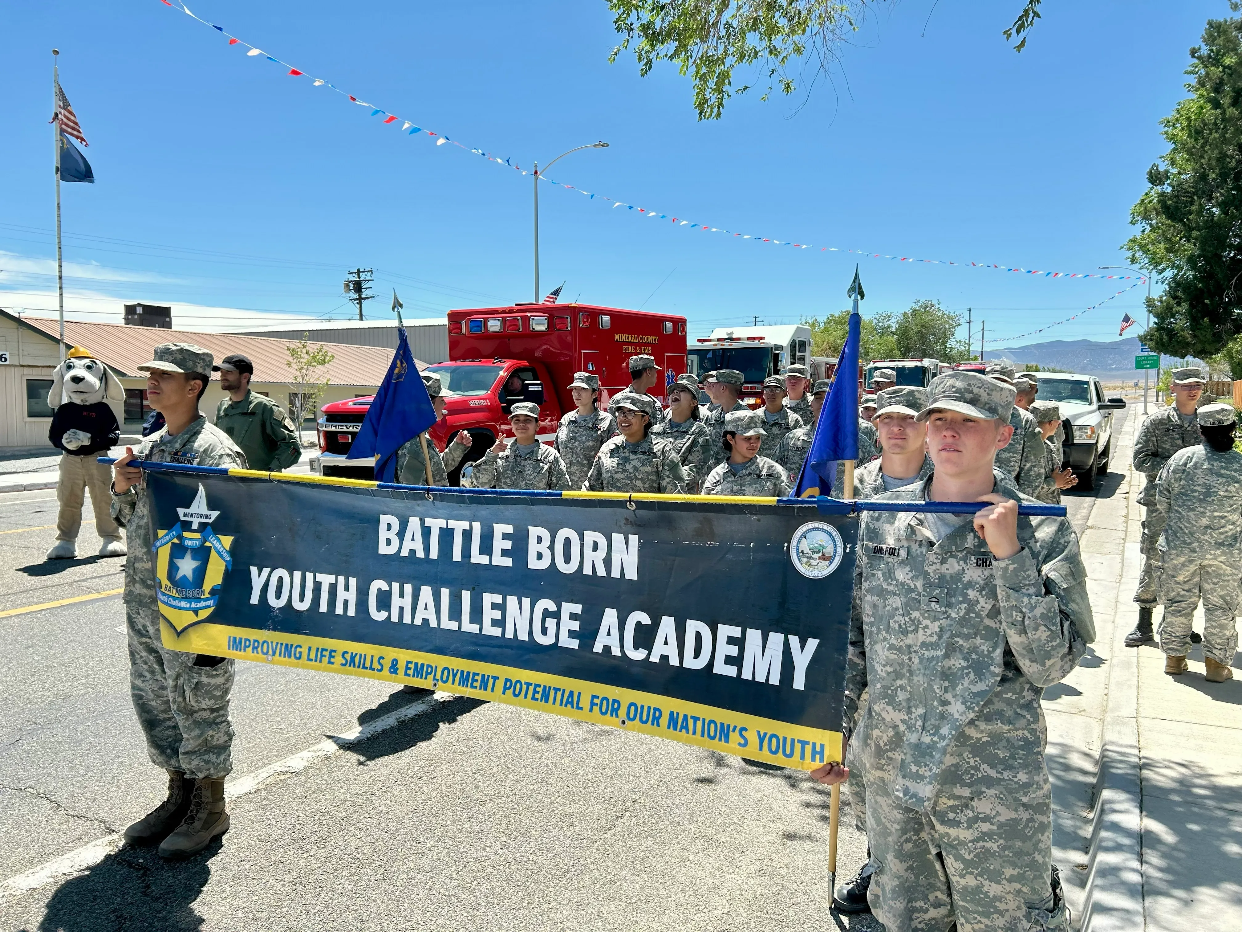 Battle Born Youth ChalleNGe Academy cadets carrying the academy banner in a community parade