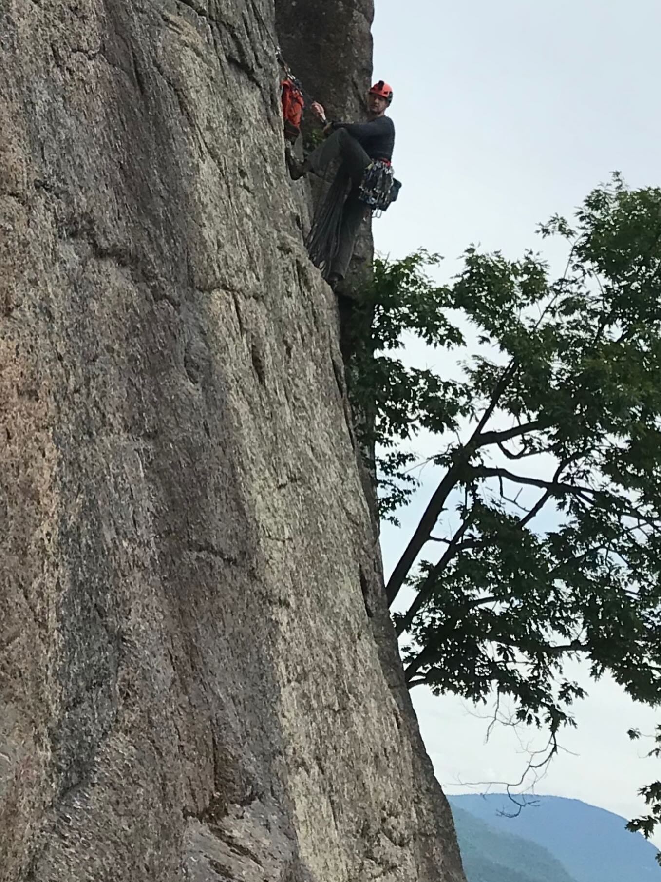 Climber working up a granite face