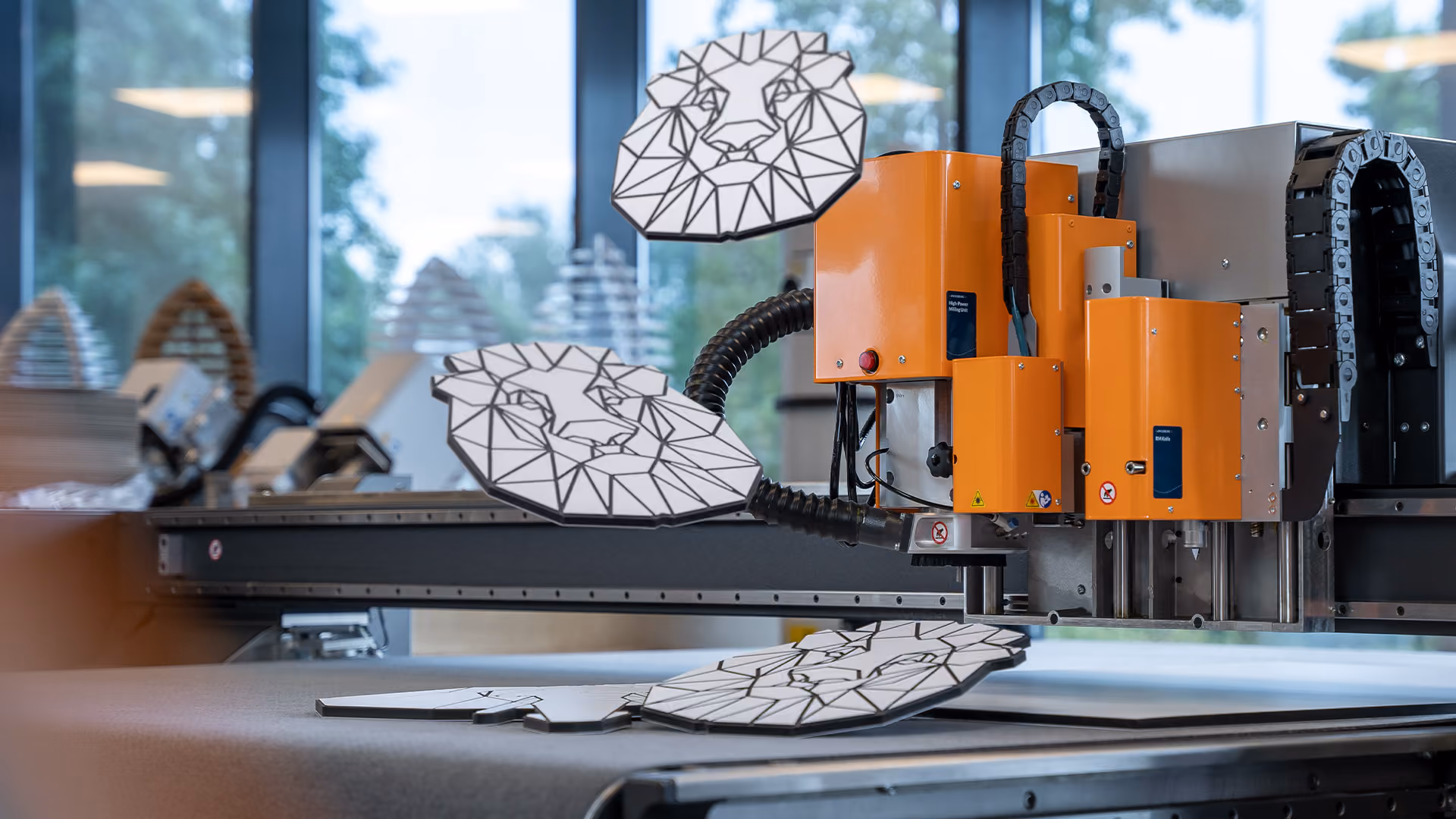 Material rising from the tabletop of a Kongsberg C Series cutting table