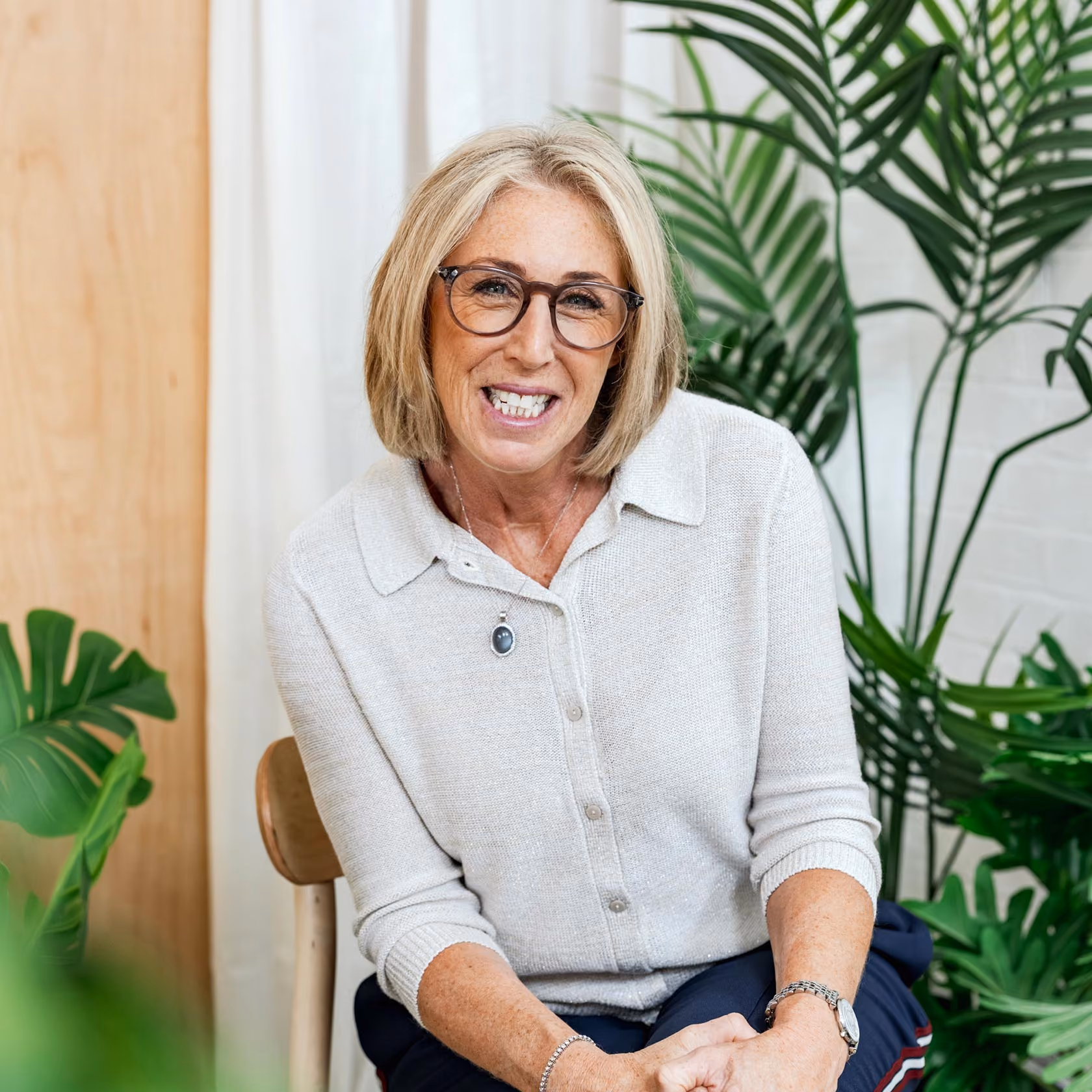 Dr Sarah Carlick smiling as she sits for a photograph.